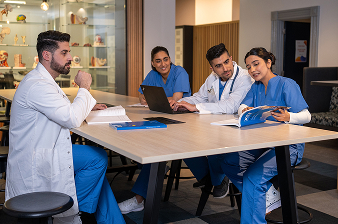 Doctors collaborating at a table.