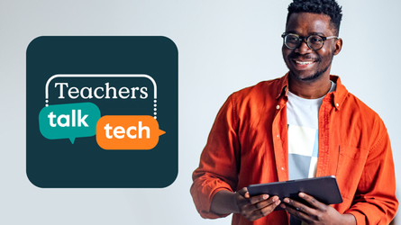 Man in suit presenting to audience.